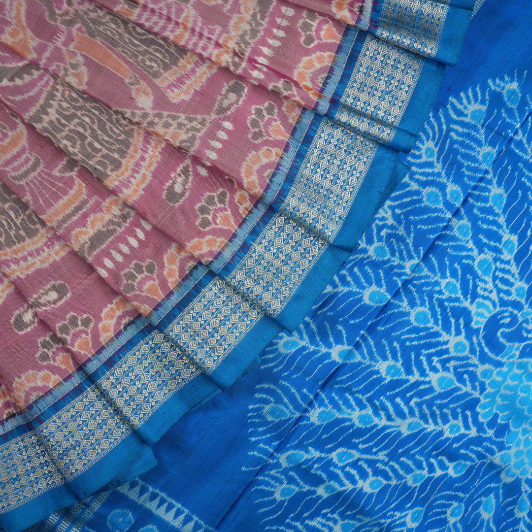 Close-up of the multi-color blue Sambalpuri silk saree fabric texture, highlighting intricate weave.