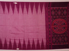 Plain pink and violet Sambalpuri cotton saree elegantly draped.