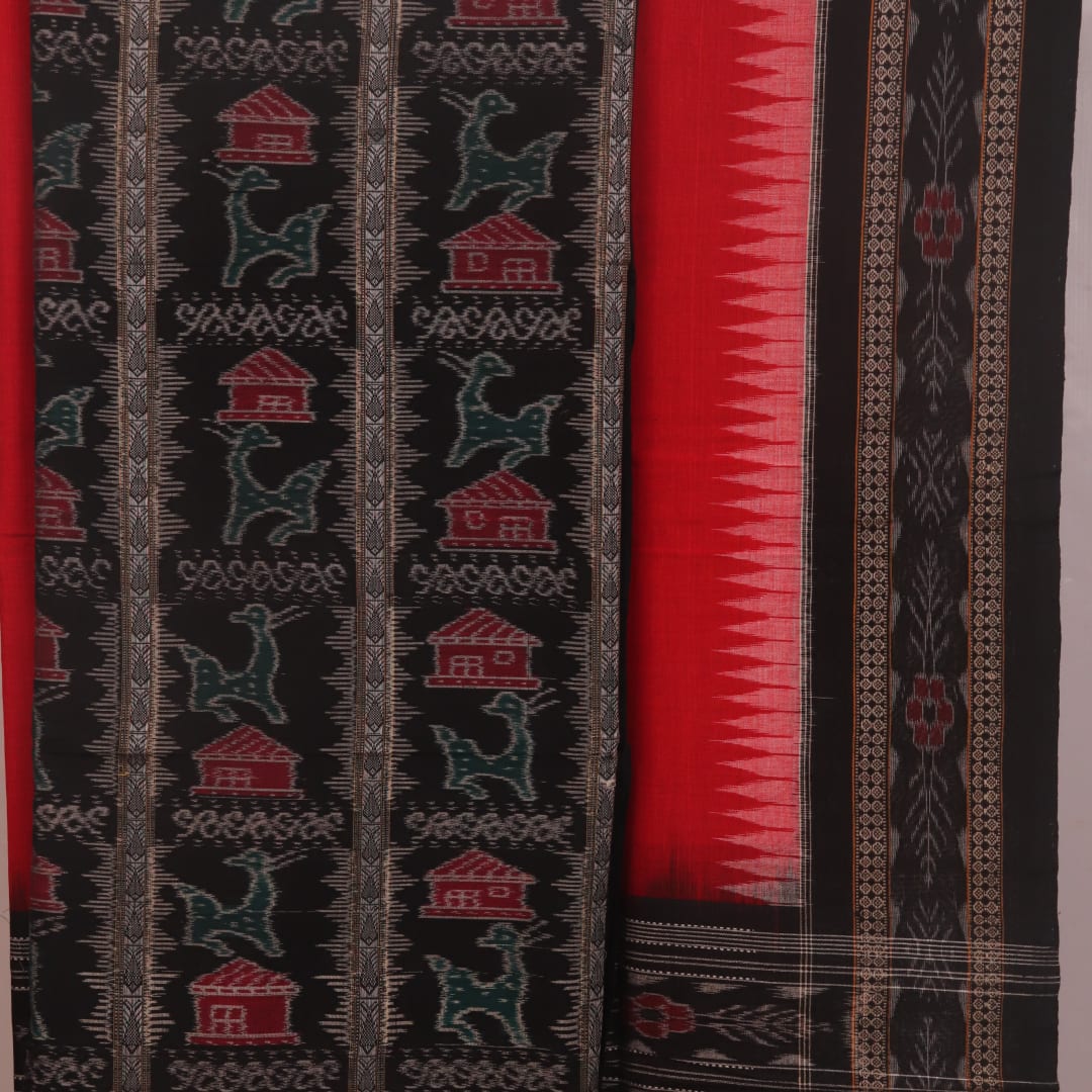 Detail of the black Sambalpuri cotton dress material's blouse piece with red motifs.