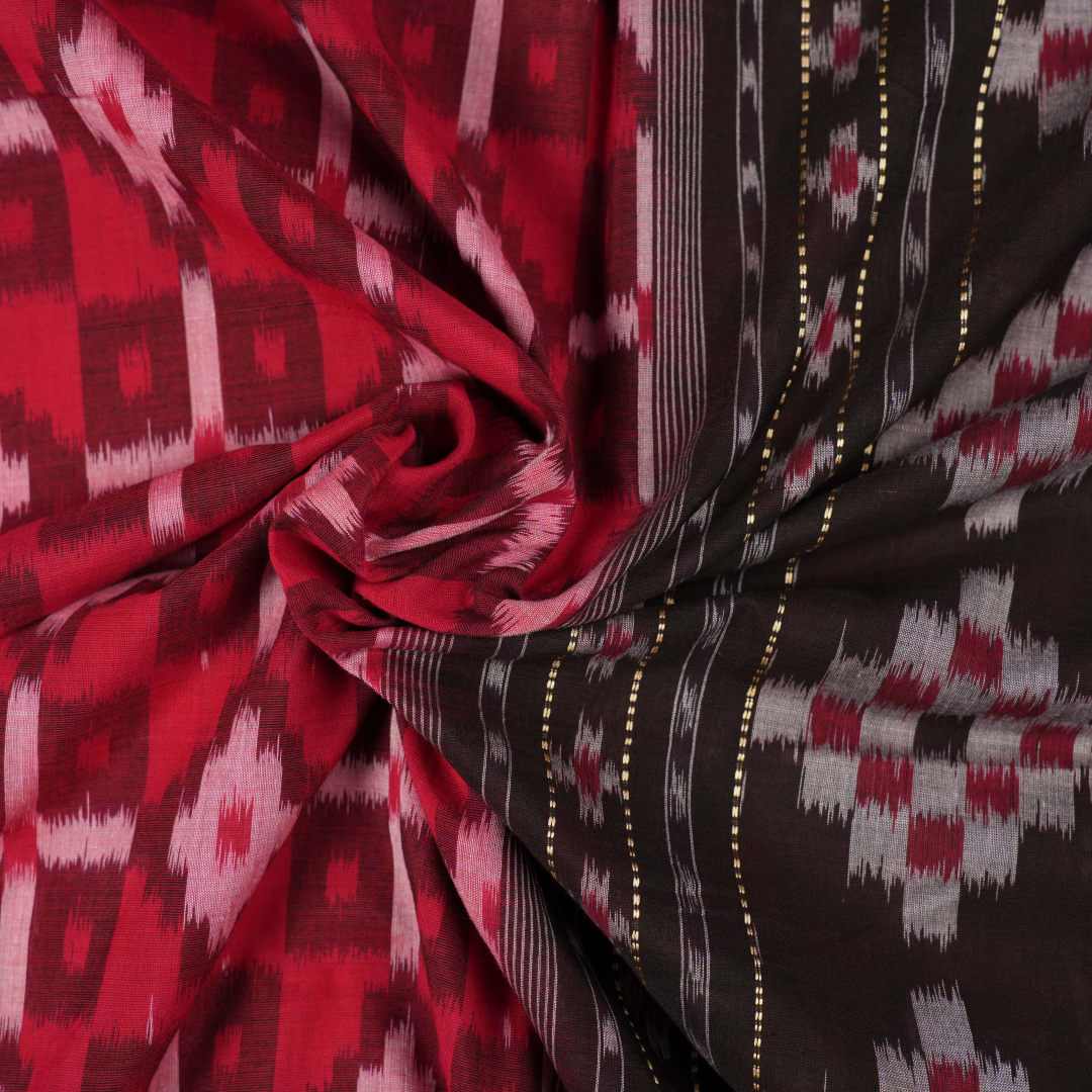 Model showcasing an elegant drape of a red and black Sambalpuri cotton handloom saree with traditional motifs
