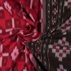 Model showcasing an elegant drape of a red and black Sambalpuri cotton handloom saree with traditional motifs