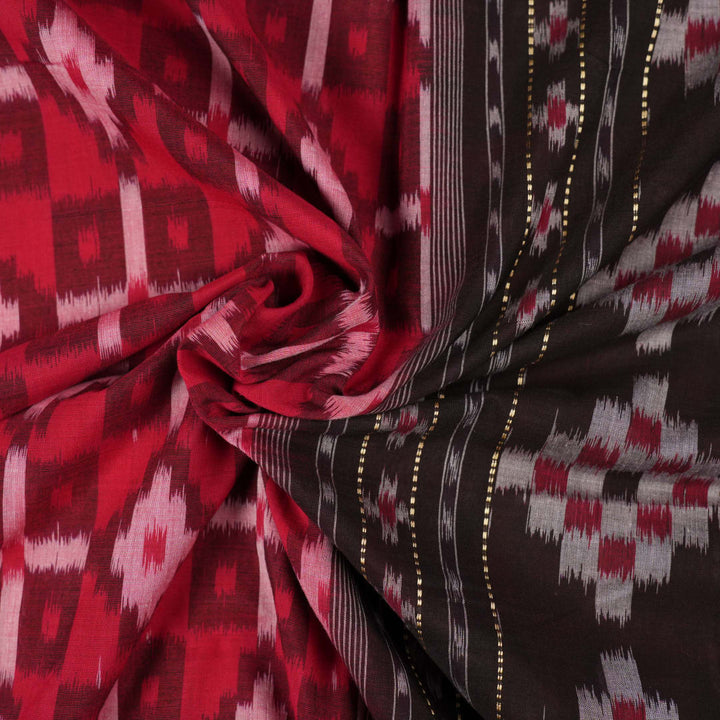 Model showcasing an elegant drape of a red and black Sambalpuri cotton handloom saree with traditional motifs