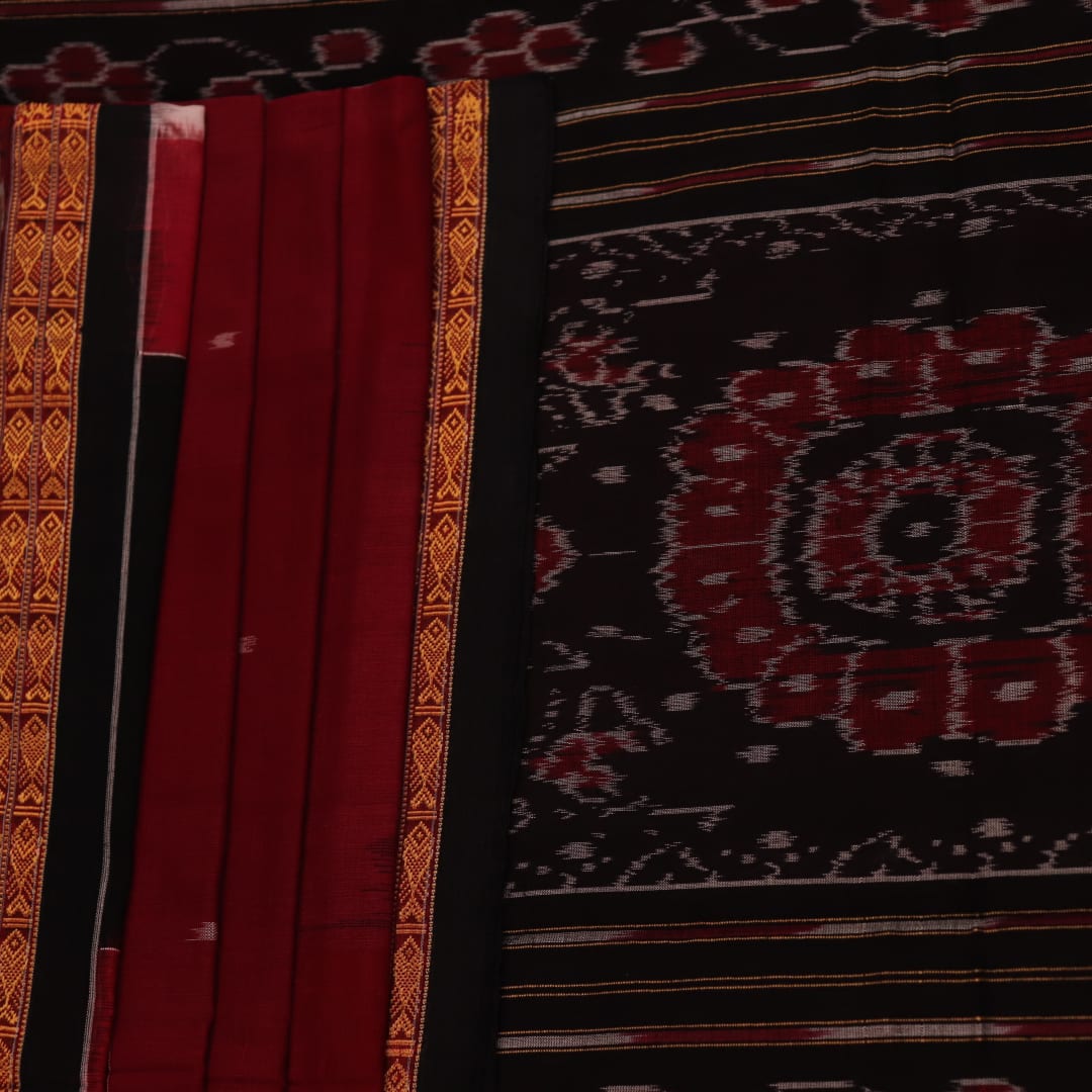 Full view of a maroon Sambalpuri cotton saree with a black Pasapalli pattern.