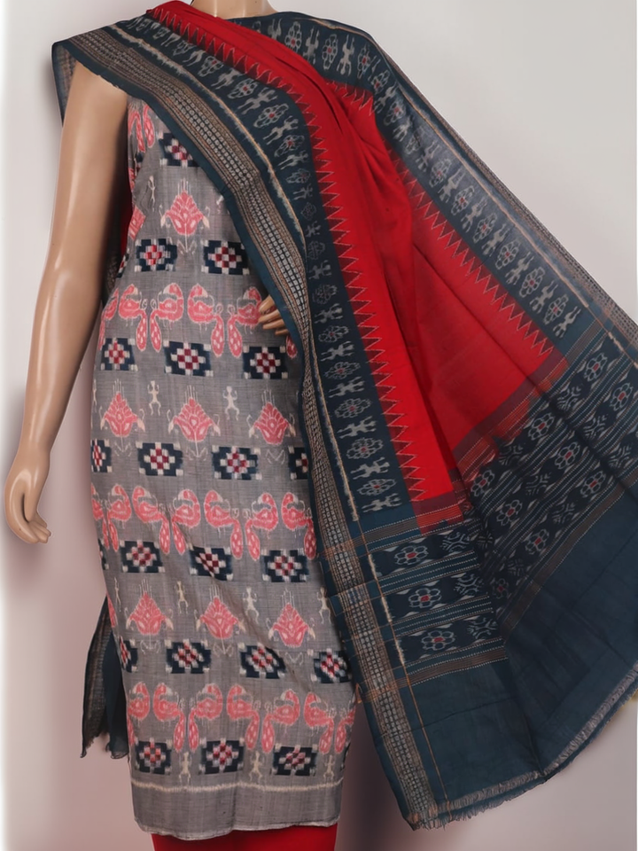 Detail of grey Sambalpuri Cotton dress material blouse piece with red motifs.