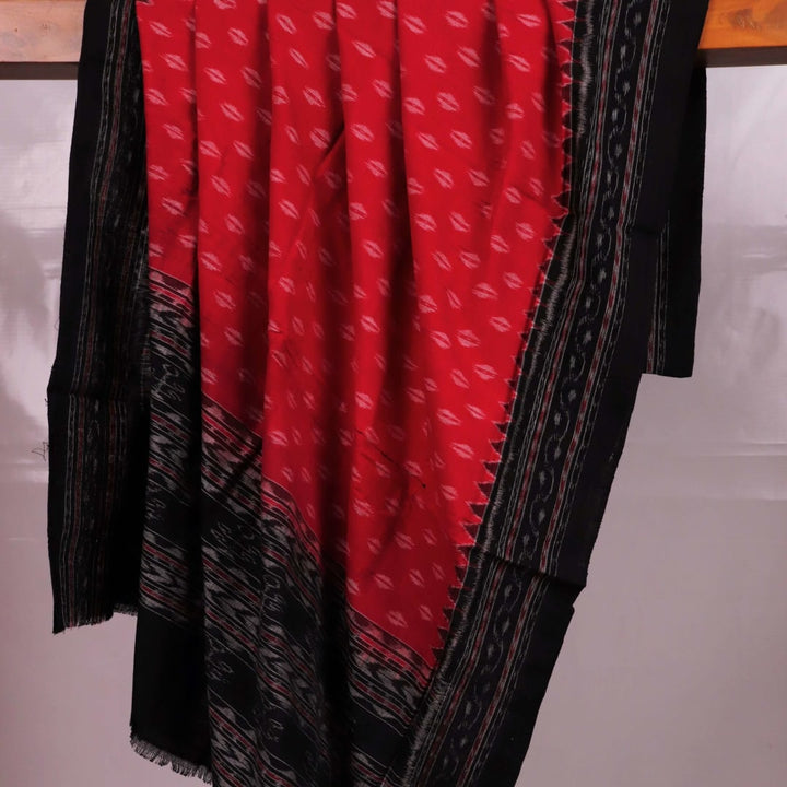 Styling view of a red and black Sambalpuri cotton dupatta with intricate motifs