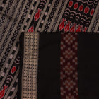 Close-up view of maroon and black silk Sambalpuri saree fabric showcasing intricate motifs