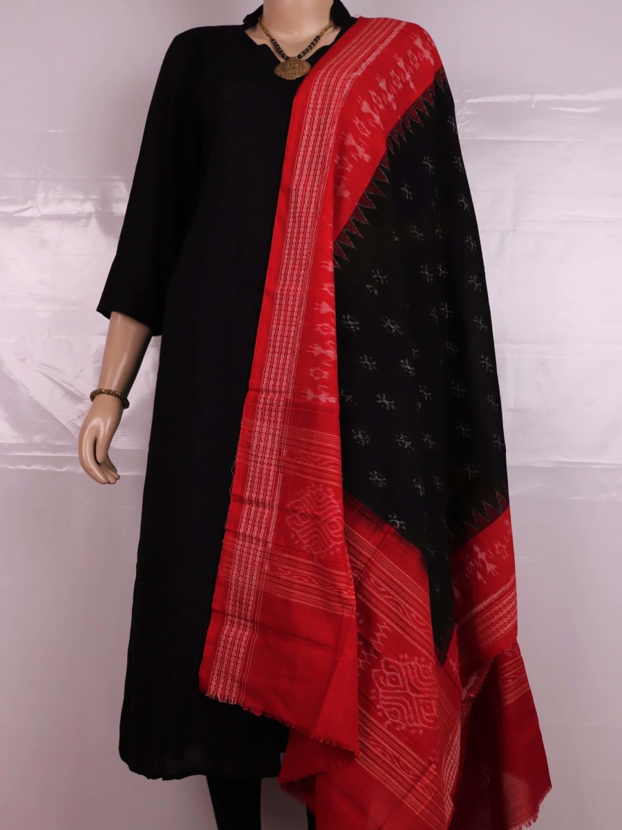 Close-up of a lightweight, black cotton Sambalpuri dupatta with red motifs in the border