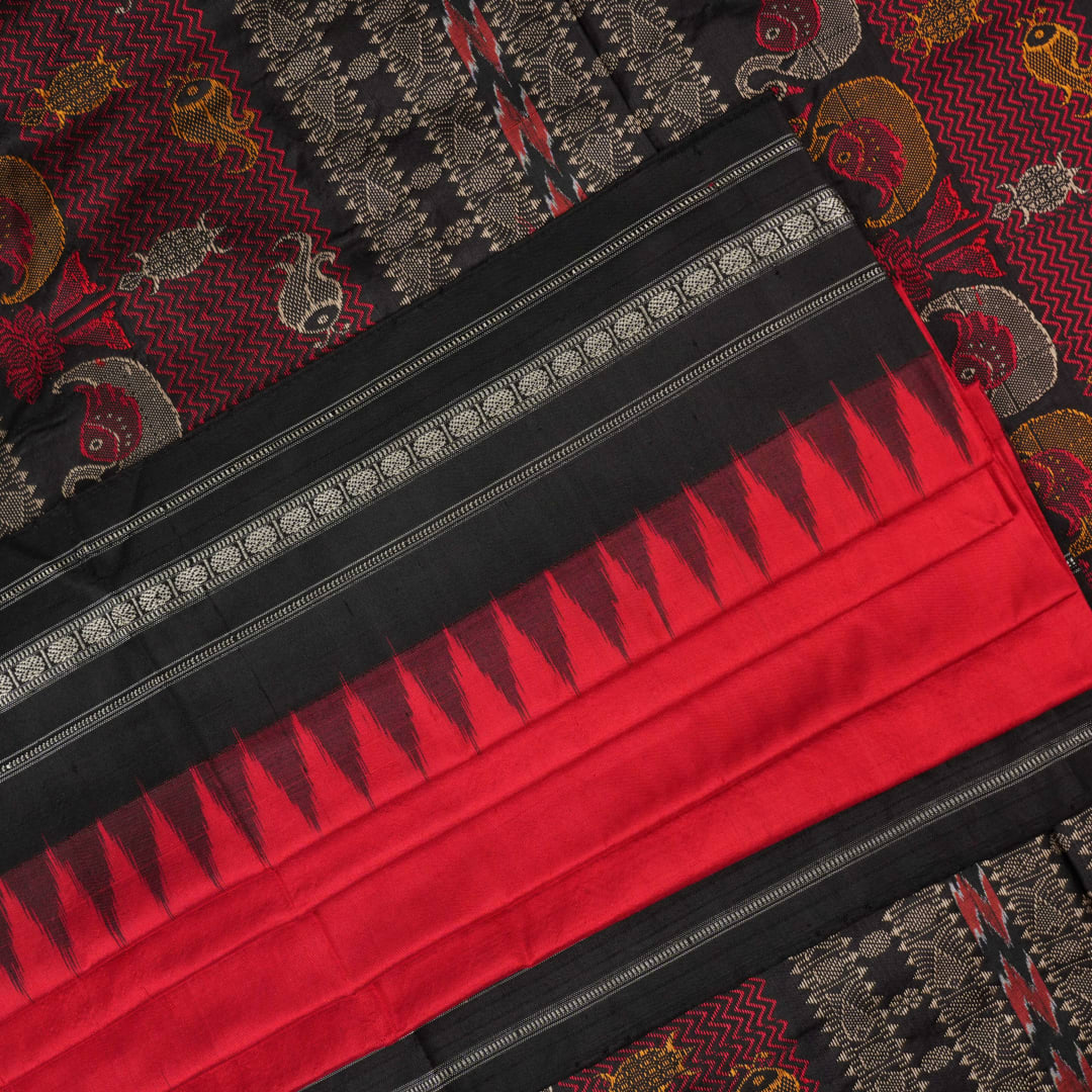 Extreme close-up revealing the fine handloom texture and intricate weave of the Bomkai silk fabric.