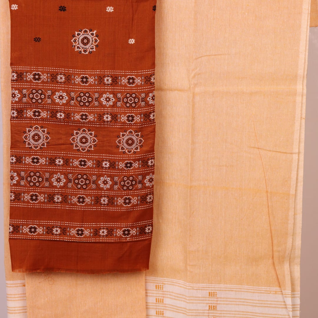 Matching blouse piece detail for the rust and cream Bomkai Cotton Dress Material, showcasing complementary weave.