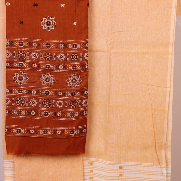 Matching blouse piece detail for the rust and cream Bomkai Cotton Dress Material, showcasing complementary weave.