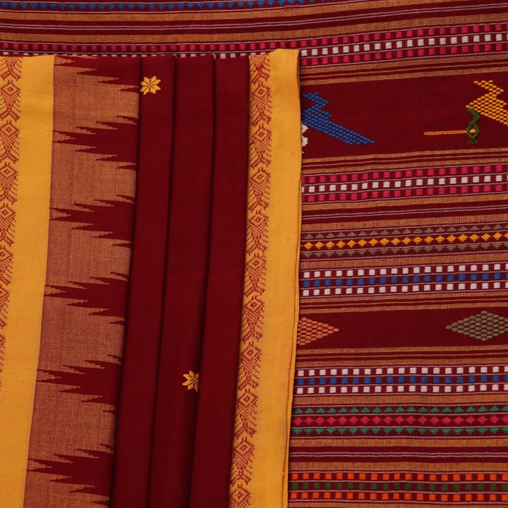 Full view of a maroon and yellow cotton Berhampuri saree with butta pattern.