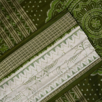 Close-up of the luxurious texture of the white Sambalpuri Silk Saree, revealing the fine weave and motif details.