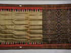 Full styling view of a model draped in a brown and black Khandua silk saree from Odisha