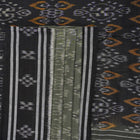 Elegant model drape of the grey and black Sambalpuri cotton saree showcasing traditional handloom motifs.