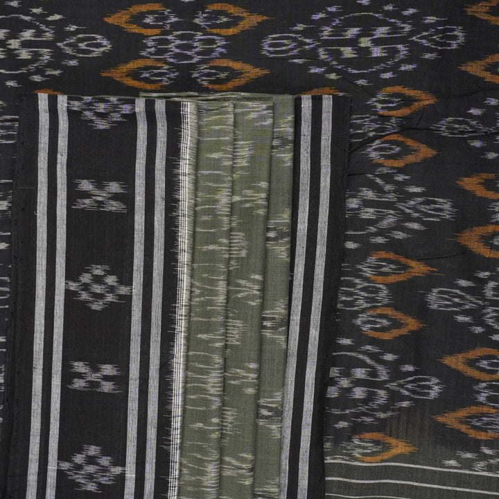 Elegant model drape of the grey and black Sambalpuri cotton saree showcasing traditional handloom motifs.