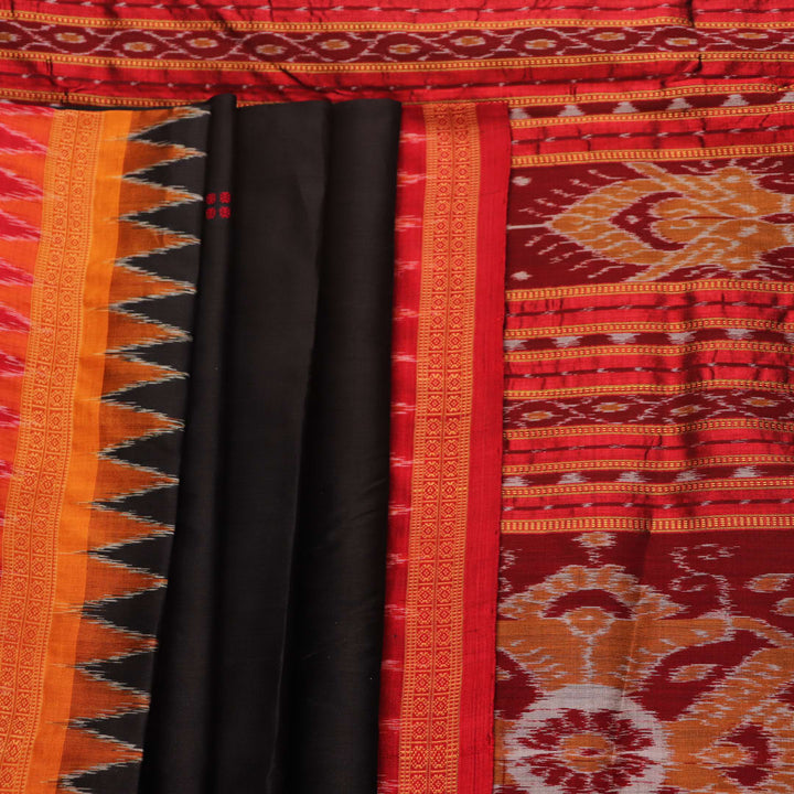 Black Khandua silk saree styled; showcases the drape and overall appearance, highlighting the red butta pattern.