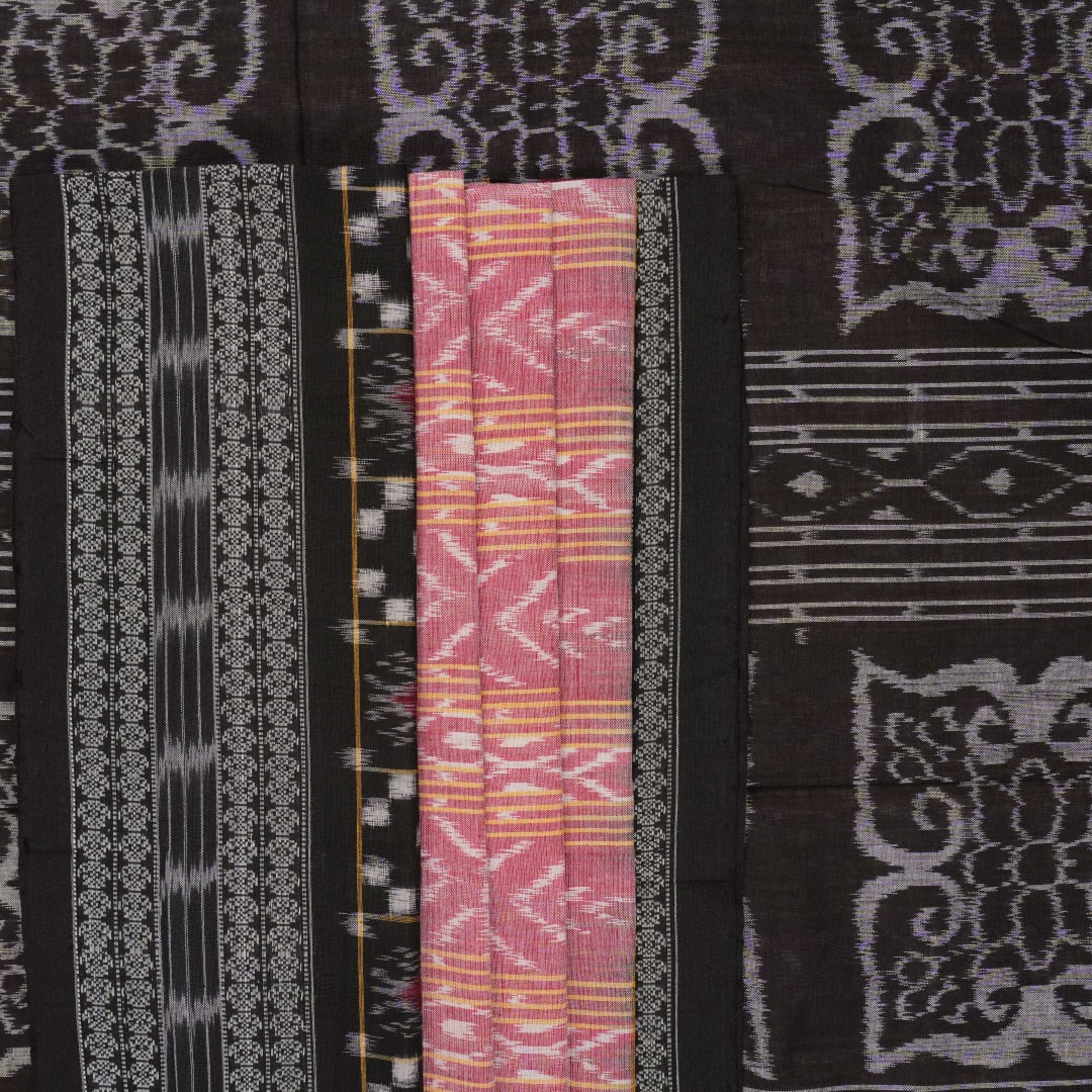 Model wearing a black Sambalpuri cotton saree with multi-color Pasapalli pattern in a full drape.