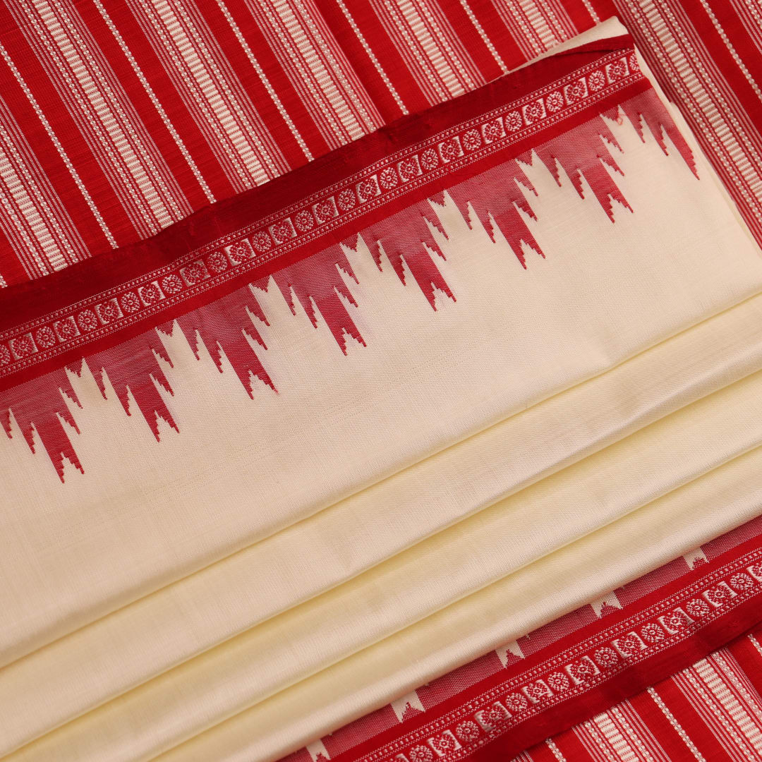 Close-up of plain white silk fabric with intricate Berhampuri weaving in red