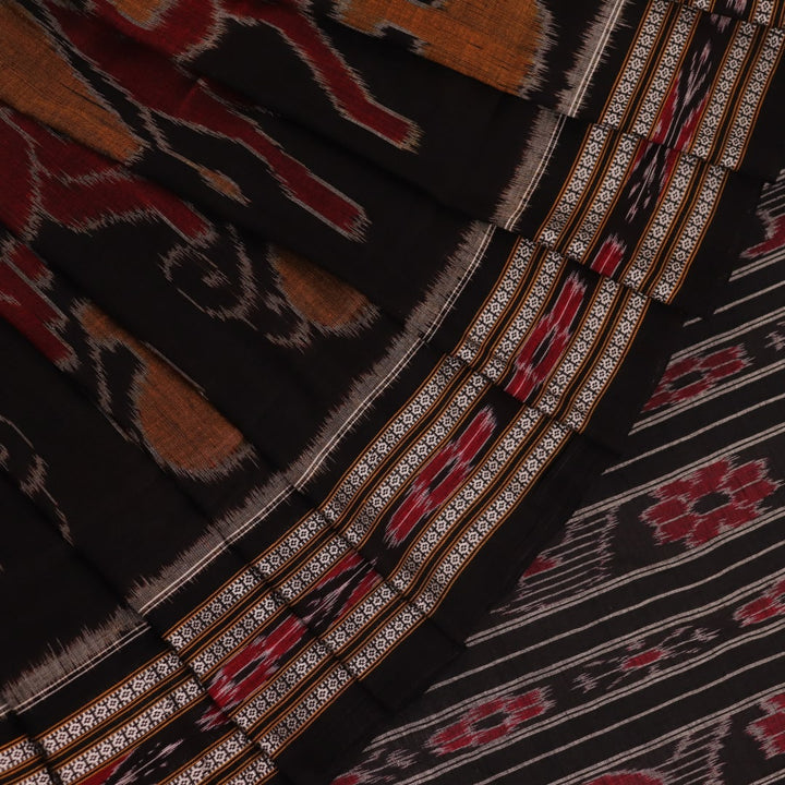 Model draped in a yellow and black cotton Sambalpuri saree with intricate motifs