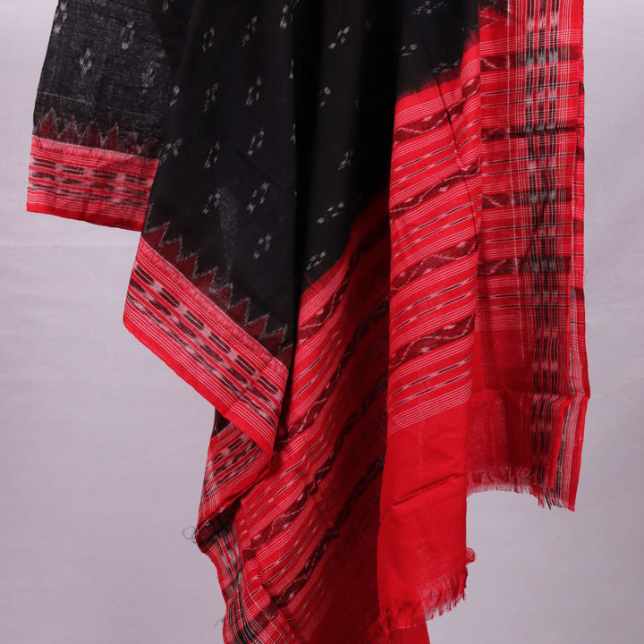 A model drapes a black Sambalpuri cotton dupatta with red motifs and pallu border.