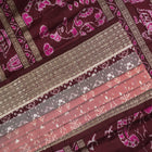 Close-up of the rich multi-color and maroon Sambalpuri silk fabric, highlighting its exquisite handloom weave texture.