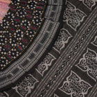 Model wearing a black Sambalpuri cotton saree with multi-color Pasapalli pattern in a full drape.