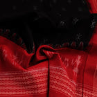 Close-up of a lightweight, black cotton Sambalpuri dupatta with red motifs in the border