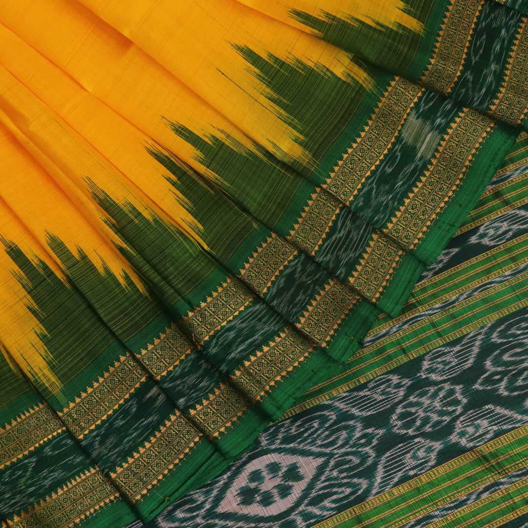 Yellow Khandua silk saree draped, showcasing its simple elegance and the plain body.