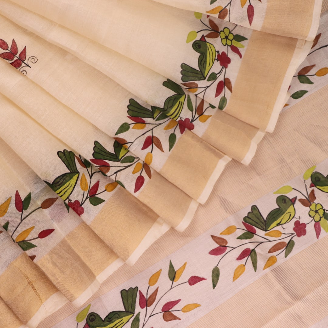 Close-up of off-white printed Tussar Silk saree fabric texture.