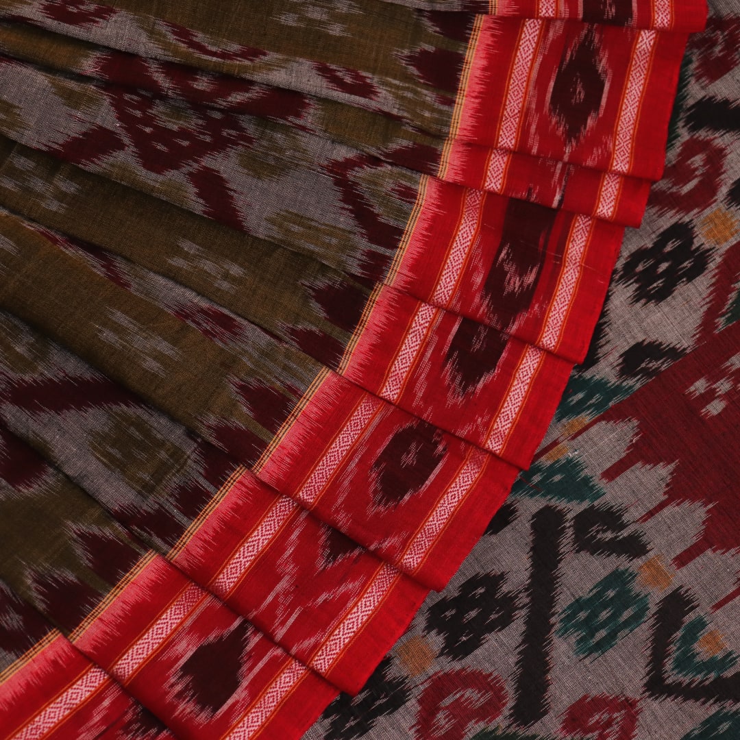 Green and Red Cotton Sambalpuri Saree Draped in a Stylized Manner