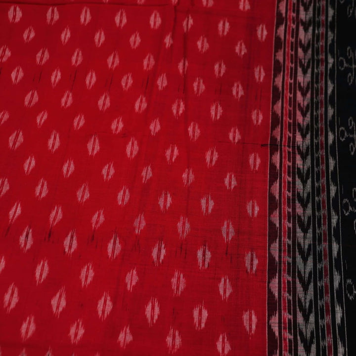 Styling view of a red and black Sambalpuri cotton dupatta with intricate motifs