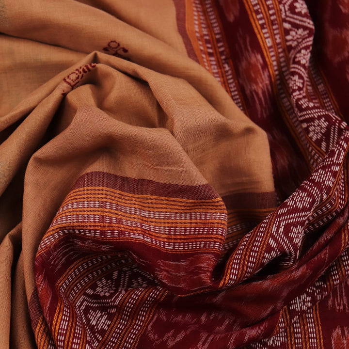 Full view of a traditional brown and maroon Bomkai cotton saree with butta patterns