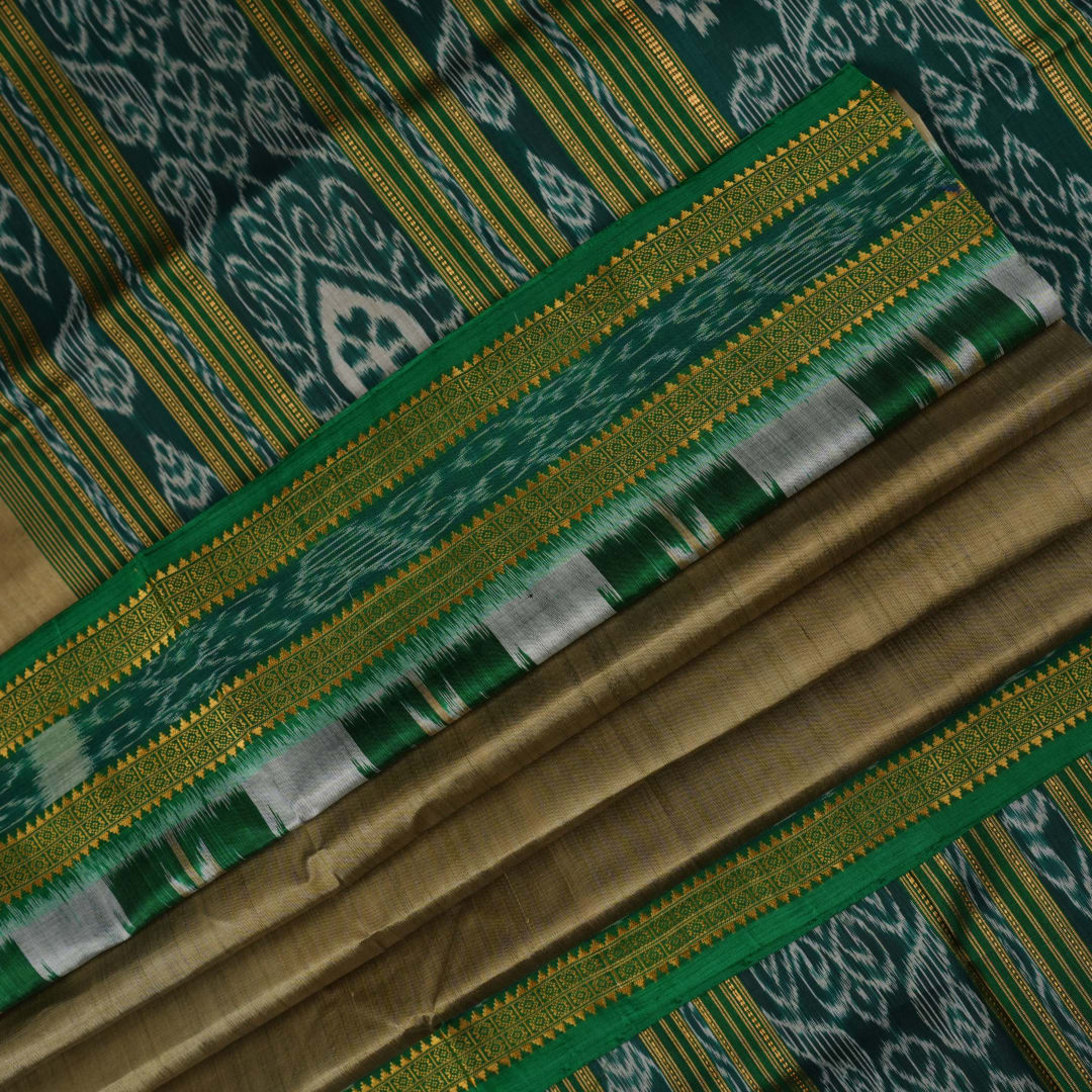 Elegant styling of a brown and green Khandua silk saree with butta work as draped on a model.