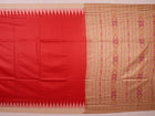 Close-up of plain red and off-white Tussar silk saree fabric texture.