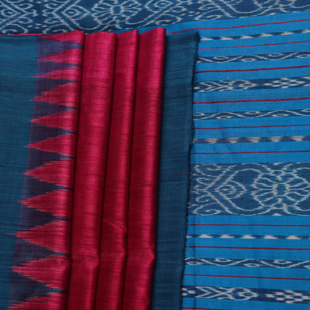 Close-up shot showcasing the textured weave of the tussar silk fabric of a plain pink and blue saree.