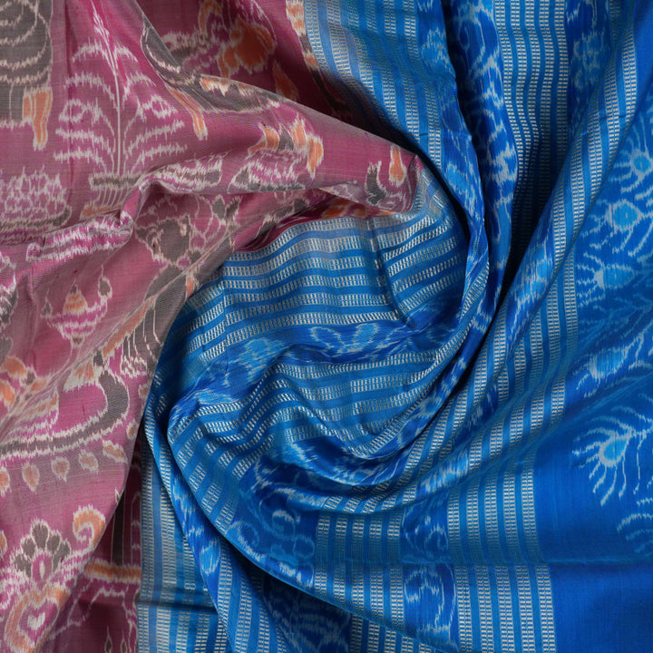 Close-up of the multi-color blue Sambalpuri silk saree fabric texture, highlighting intricate weave.