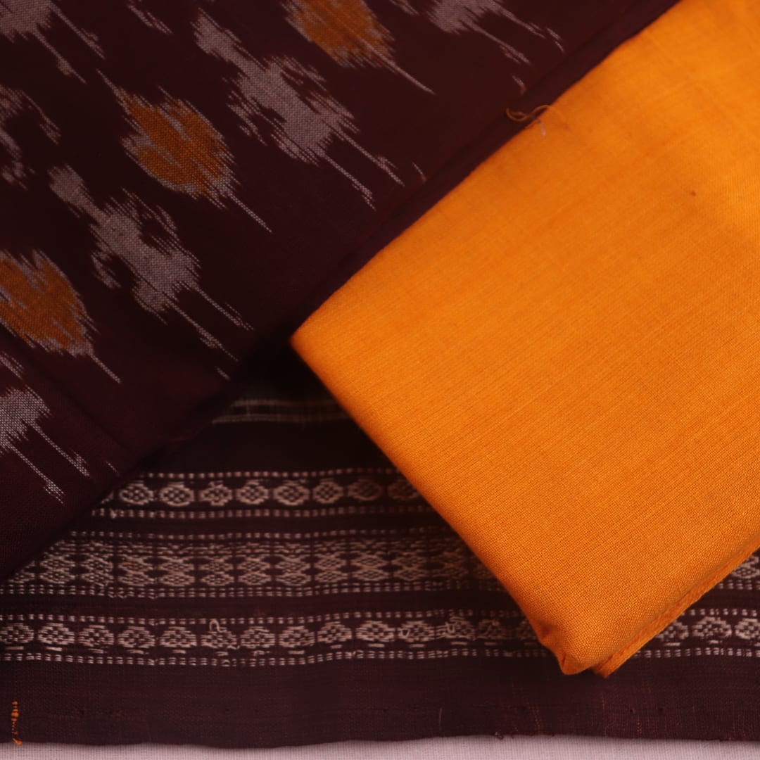 Detail of maroon and yellow Sambalpuri cotton dress material's blouse piece with motifs.