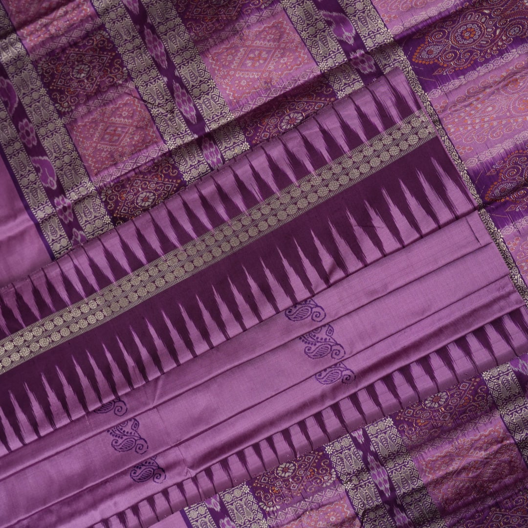Close-up of purple Bomkai Silk Saree fabric, revealing its luxurious silk texture and exquisite handloom weave.
