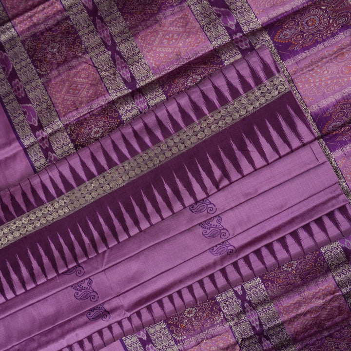 Close-up of purple Bomkai Silk Saree fabric, revealing its luxurious silk texture and exquisite handloom weave.