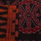 Brown and black plain Sambalpuri cotton saree elegantly draped.
