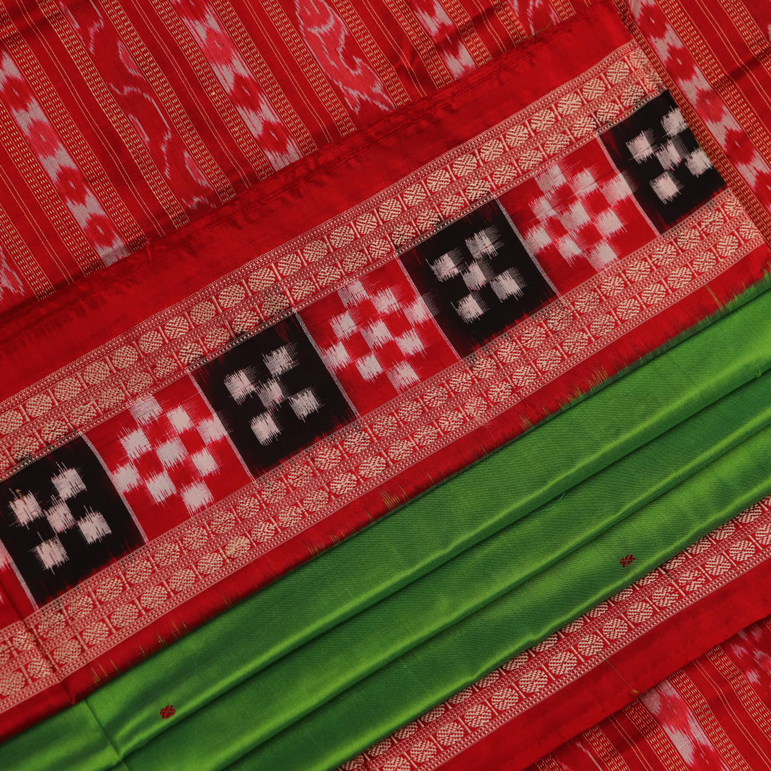 Close-up view of light green Pasapalli pattern woven on silk Sambalpuri saree fabric