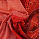 Styling view of a plain multi-color & rust Sambalpuri cotton saree.
