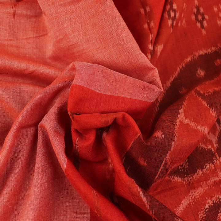 Styling view of a plain multi-color & rust Sambalpuri cotton saree.