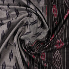 Model styled in a grey and black Sambalpuri cotton saree showing the elegant drape and traditional motifs.