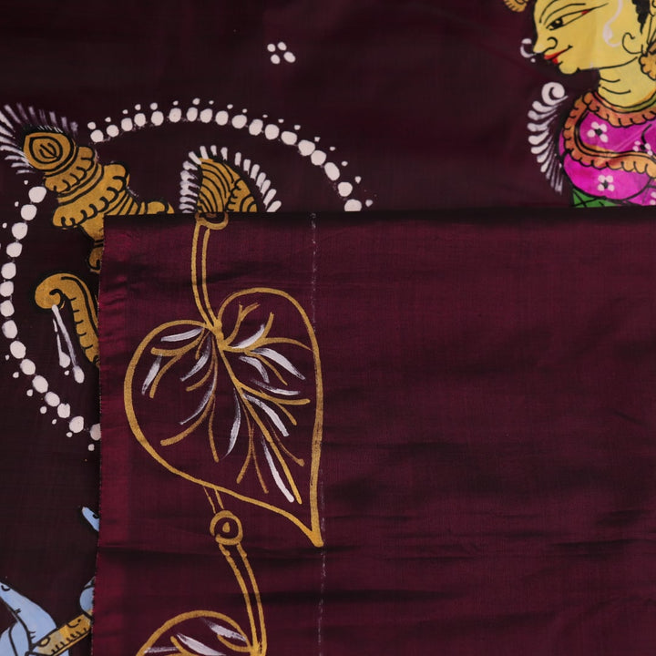 Close-up of a hand-painted silk Patachitra saree, highlighting the vibrant, textured weave and intricate details.