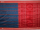Close-up of blue and orange silk fabric texture with woven motifs