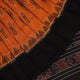Woman draped in a yellow and black Sambalpuri cotton saree, showcasing the stylish drape and motif pattern.
