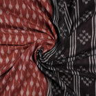 Full styling view of a model draped in a brown and black Sambalpuri cotton saree with traditional motifs.