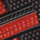 Model wearing a rust and black Sambalpuri cotton saree styled with traditional Odisha handloom motifs.