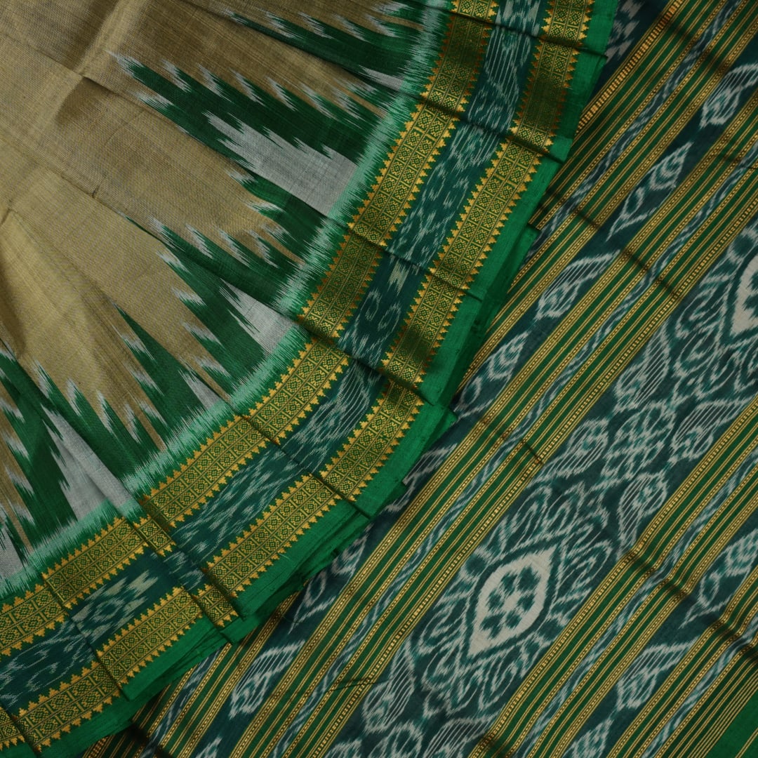 Elegant styling of a brown and green Khandua silk saree with butta work as draped on a model.